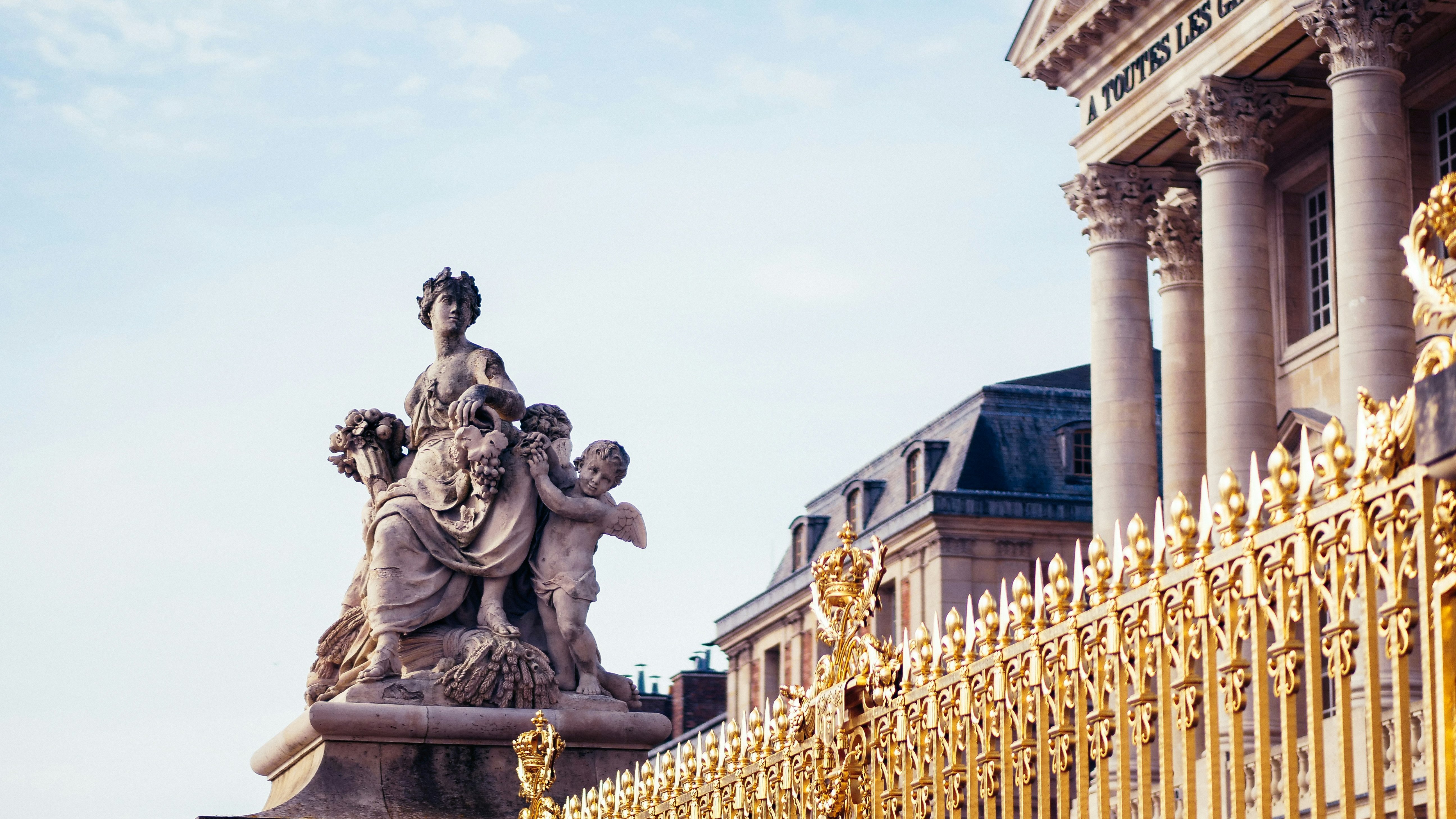 Golden fence, a statue and columns