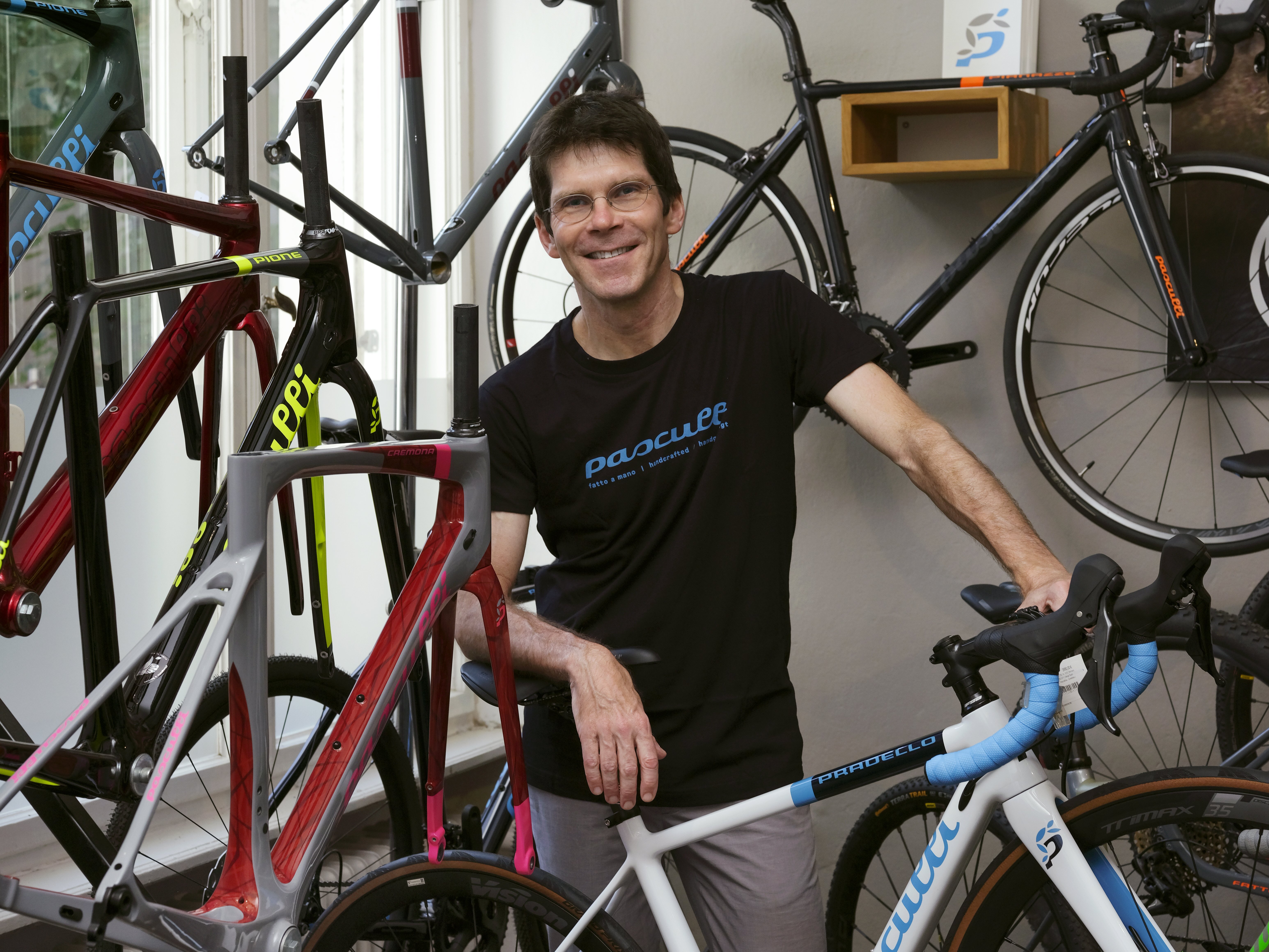 Christoph Hartmann in front of his bicycle