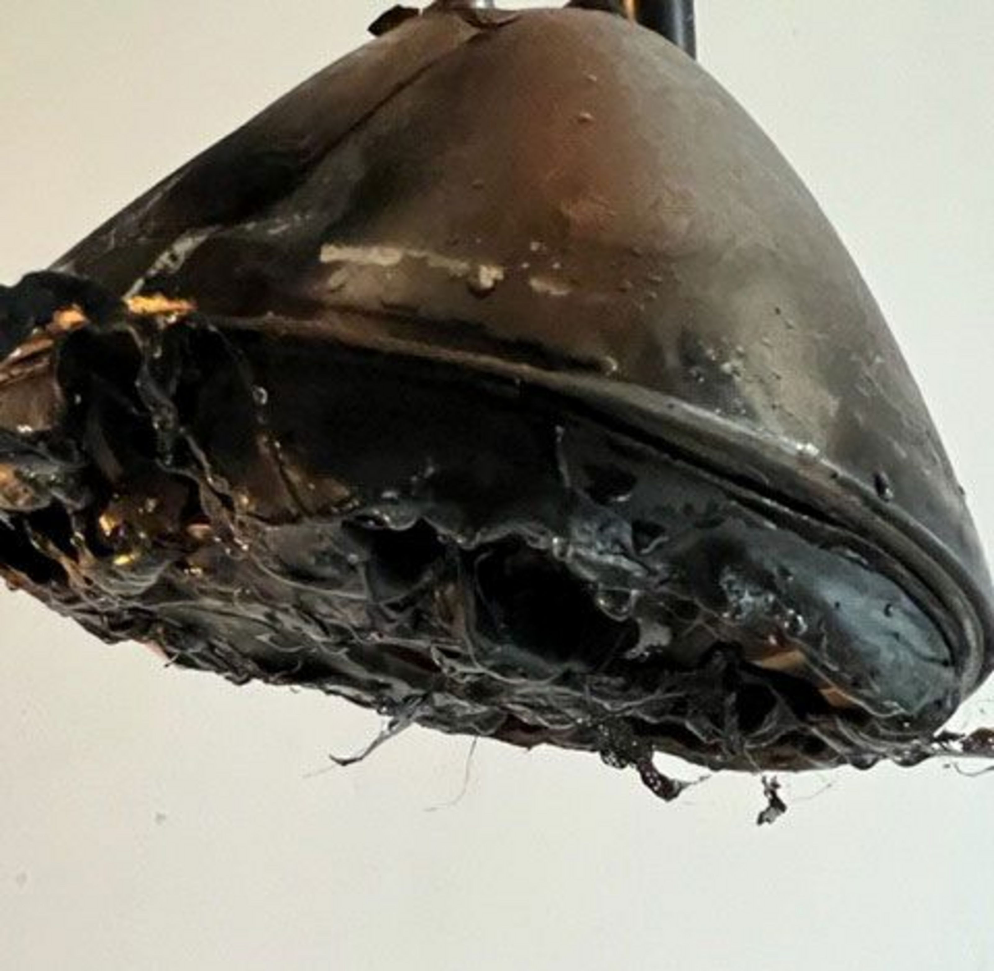 A burned, black tea kettle.