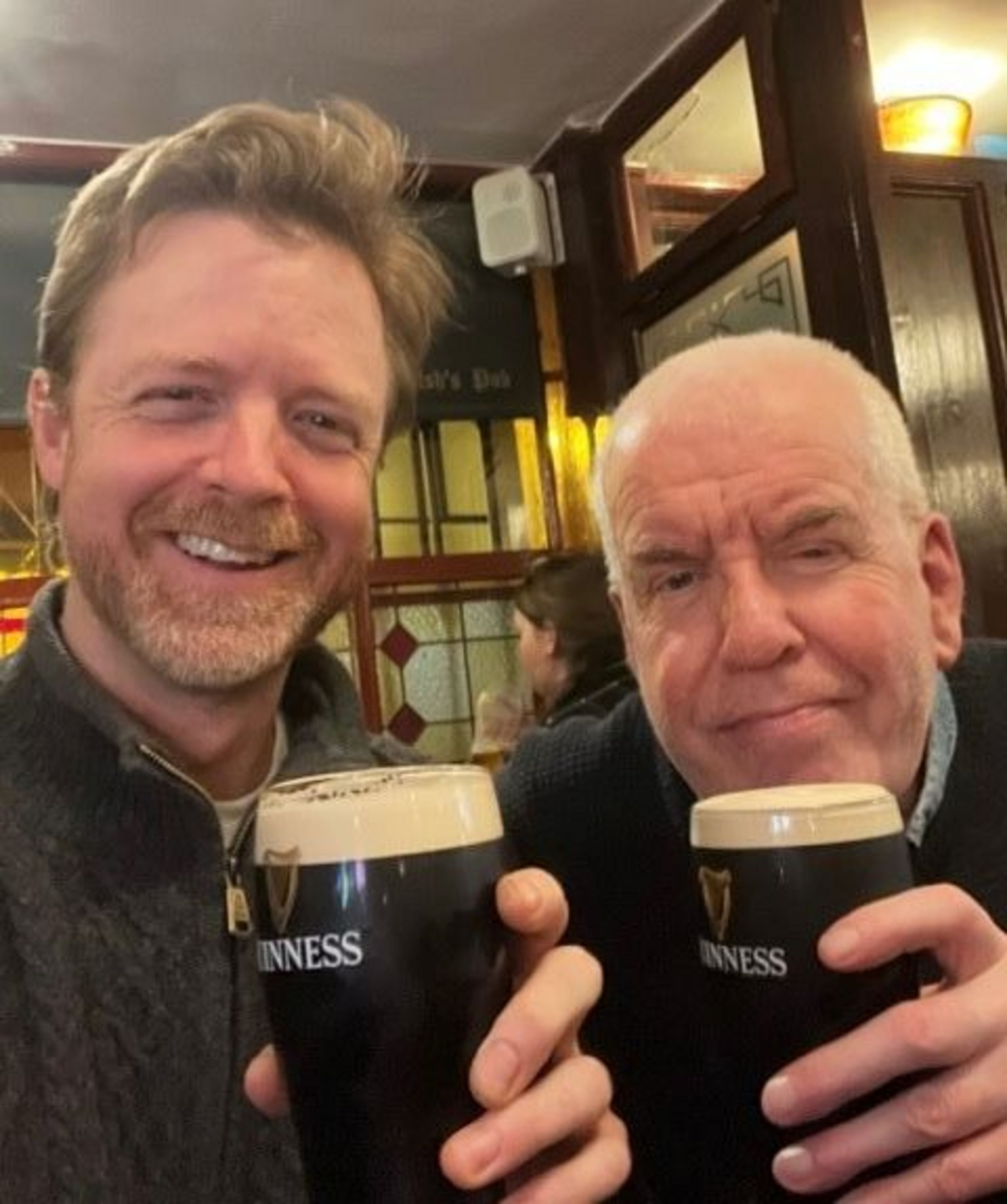 Matthew McDonald (left) and Gerald Barry (right) cheers with a Guiness.
