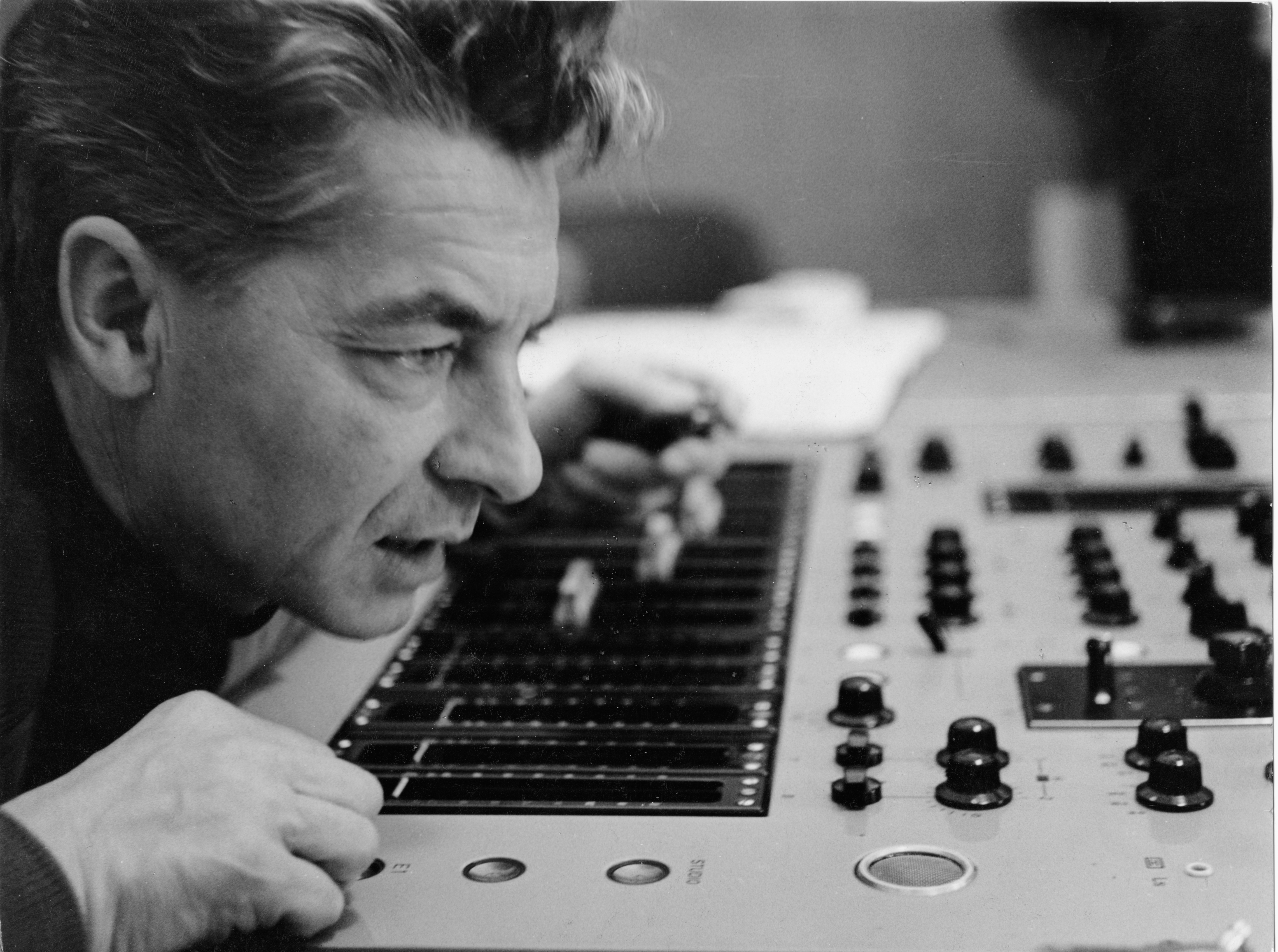 Herbert von Karajan looking at a mixing desk.